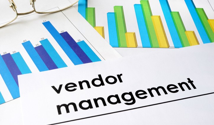 Paper with words Vendor management and charts.