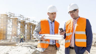 construction engineers checking real time gps tracker