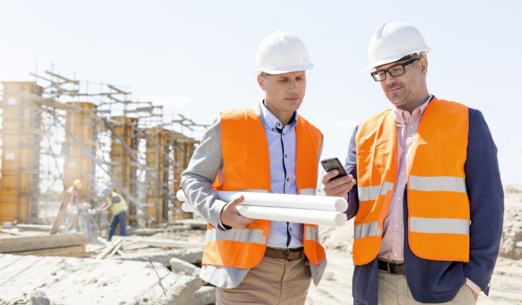 construction engineers checking real time gps tracker