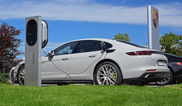 White Porsche Panamera E Hybrid an electric vehicle at charging station