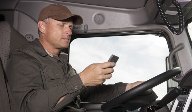 Truck driver busy in texting and not focused on driving