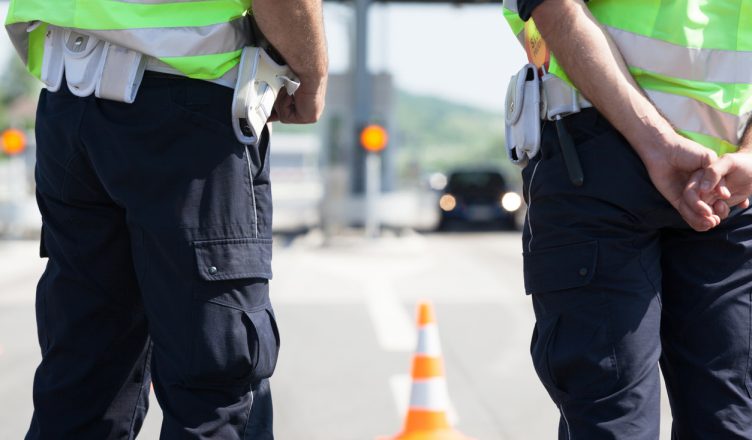 policemen standing on road for traffic inspection