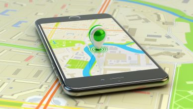 Smartphone with city map application and marker pin pointer on phone screen