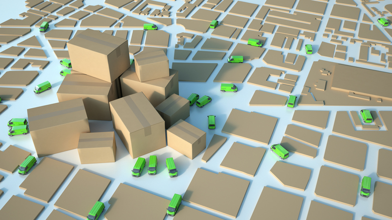 3D rendering of a cardboard textured map with green trucks circulating and a pile of cartons