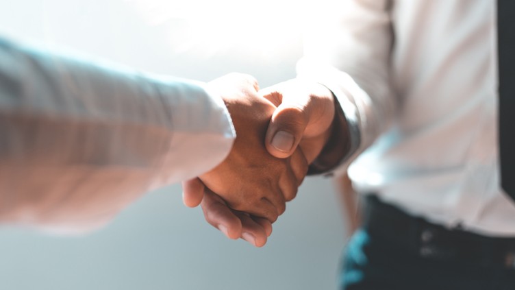 Men and women negotiate to congratulate a successful business ,Shaking hands concept.