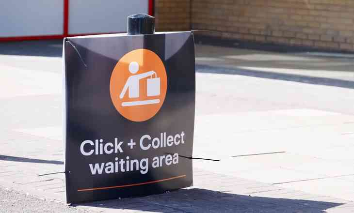 Click and collect online internet shopping sign at shop car park lane uk