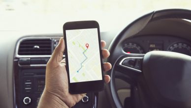 Man using a smart phone to navigate best directions to work