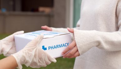 Asian female patient receive medication package box free first aid from pharmacy hospital delivery service at home wear glove in telehealth, telemedicine healthcare insurance online concept. This is an example of how to start a medical courier service