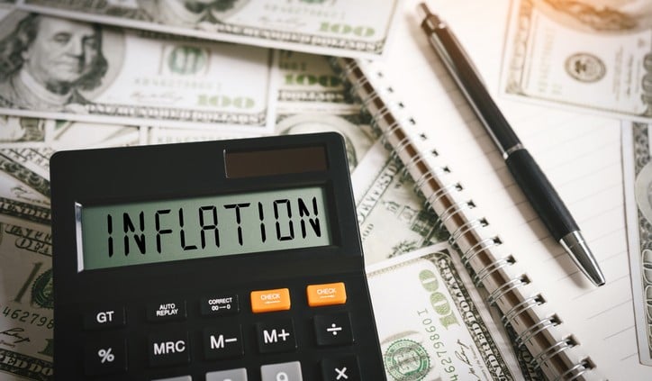 INFLATION word on calculator in idea for FED consider interest rate hike, world economics and inflation control, US dollar inflation