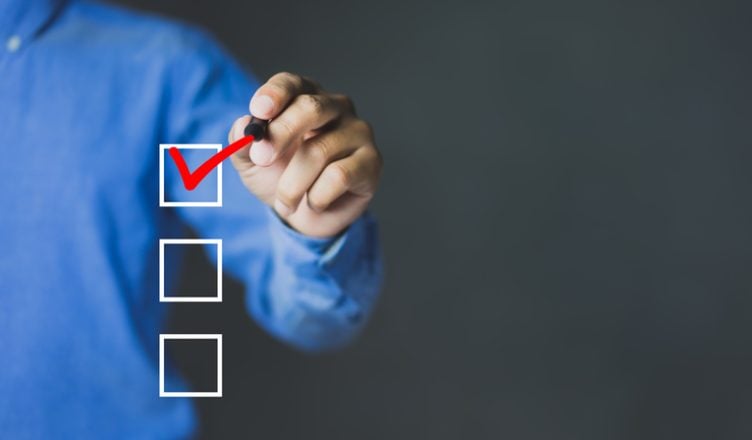 Checklist concept, Businessman checking mark on the checkbox, copy space