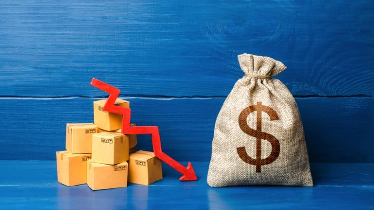 Dollar money bag with boxes and down arrow. Income decrease, slowdown and decline of economy. Bad consumer sentiment and demand for goods. Low sales. Production decline. Reduced transportation prices.