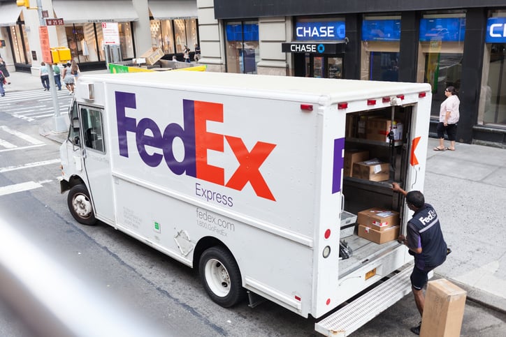 New York City, NY, USA - July 7, 2015: FedEx Express truck in midtown Manhattan. FedEx is one of the leading package delivery services offering many different delivery options.