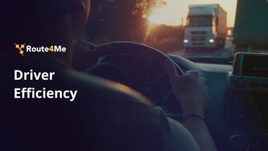 Driver gripping a steering wheel at sunset with trucks ahead and the Route4Me ‘Driver Efficiency’ text overlay.